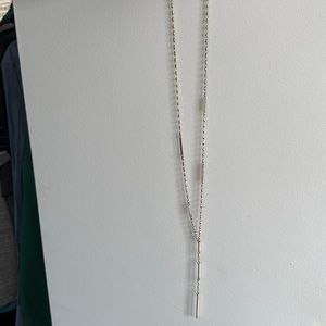 Long, gold pendant necklace